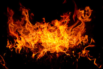 Fototapeta premium Blaze fire flame texture background. Fire sparks background. Abstract fire flame texture for banner background. Fire flame with copy space for advertising.
