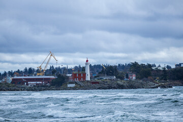 Fototapeta premium Scenic View of Lighthouse and Harbor in Victoria, BC, Canada