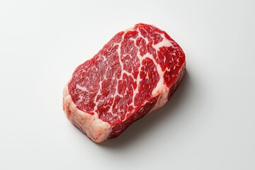 Fototapeta premium Raw Red Meat Steak with Visible Marbling of Fat on White Background