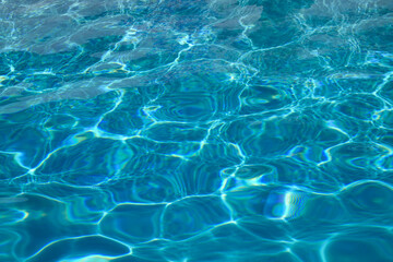 Obraz premium Water texture. View of swimming pool surface. Blue water background. Blue water texture background. Surface of pool water.