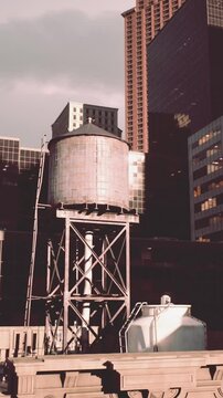 cityscape at sunset, with the roofs of towering buildings in focus