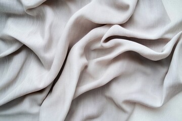 Close-up of Crumpled Gray Cotton Fabric on Neutral Background with Soft Textures and Folds