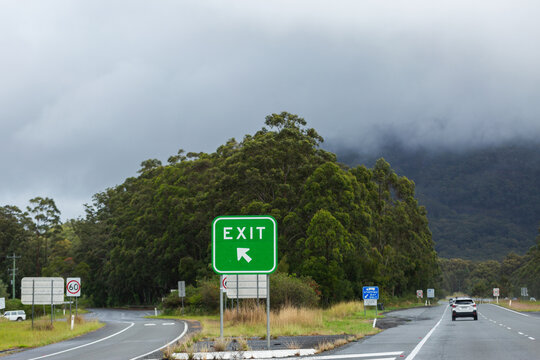 exit sign on highway on east coast of Australian in overcast rainy weather