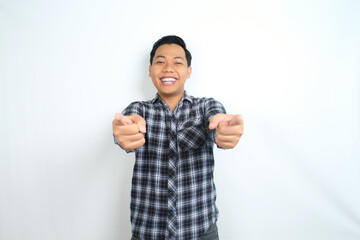 Fototapeta premium happy asian man pointing hand with smiling face and confident gesture isolated on white backgroun wearing plaid shirt