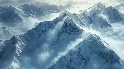 Obraz premium Aerial view of snow-capped mountains with clouds.