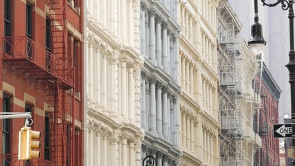 Obraz premium New York City Manhattan Soho fashion district near Broadway street. USA urban building facade, old classic american architecture. Shopping in NYC, United States. Business and residential real estate.