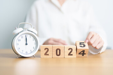 2024 end year to Happy New Year 2025 with vintage alarm clock. Christmas, New Start, Resolution,...