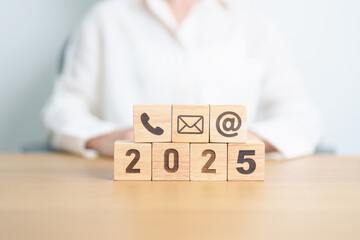 Happy New Year 2025 block for Contact Us concepts. Wood block of Email, call Phone and Website...