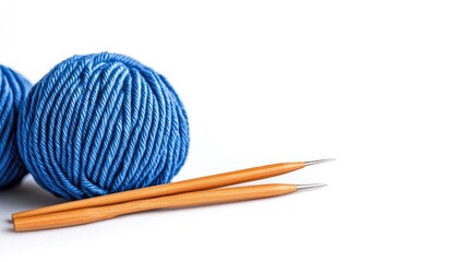 Colorful yarn and wooden knitting needles create a cozy atmosphere for crafting and creativity