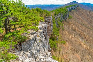 Seneca Rocks with lush greenery and cliffs.