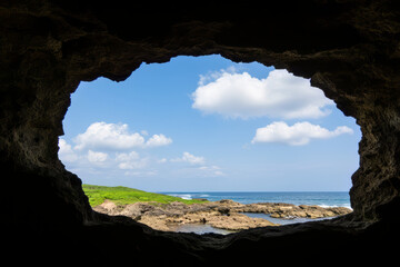 scenic view of ocean through cave opening, showcasing nature beauty