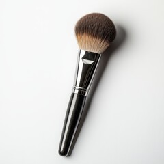 A makeup brush with a soft, rounded bristle head for applying cosmetics.