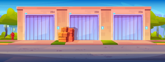 Fototapeta premium Pink building exterior of self storage units with purple doors set on blue sky. Stack of boxes placed near middle entrance. Green bushes and red hydrant in background. Personal storehouse business.