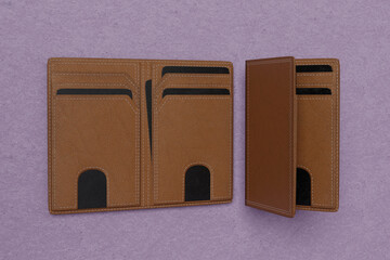 Blank leather wallet brown fold mock up, isolated, 3d rendering. Empty fabric clutch mock up front view V6