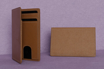 Blank leather wallet brown fold mock up, isolated, 3d rendering. Empty fabric clutch mock up front view V3