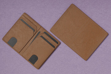 Blank leather wallet brown fold mock up, isolated, 3d rendering. Empty fabric clutch mock up front view V2
