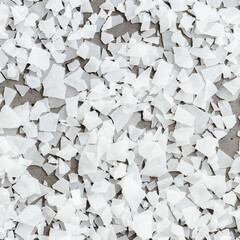 Close-up of magnesium flakes on gray concrete background, salt crystalline texture. Natural White...