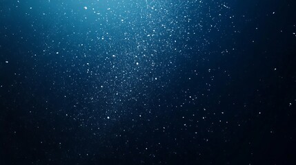 Obraz premium Snowflakes Falling Against Dark Blue Background