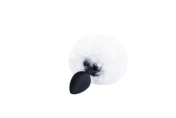 black silicone butt plug with a rabbit tail made of white faux fur on a light background