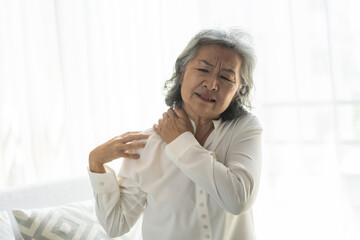 Elderly woman experiencing neck pain, senior woman with discomfort health care concept, aging and chronic pain, neck stiffness, senior wellness, pain relief, elderly care, healthcare, muscle ache