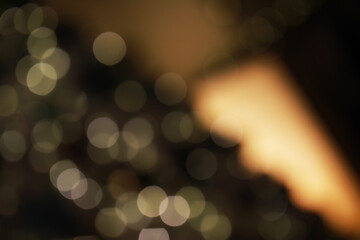 Abstract Bokeh Lights Defocused Background with Warm Golden and Green Hues