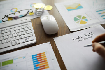 Estate Planning Documents with Charts and Financial Data on Desk