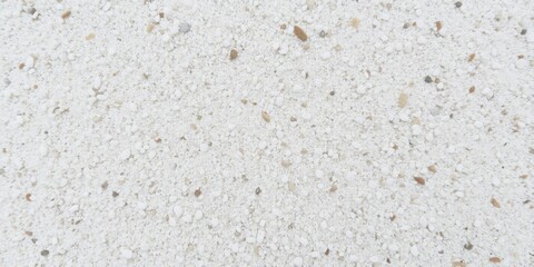 Sand scattered on a white surface, creating a textured pattern, sand, nature