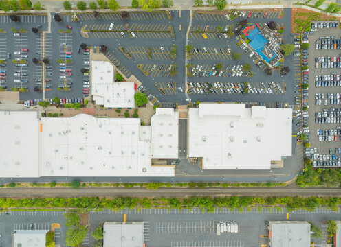 A parking lot with a large building in the background