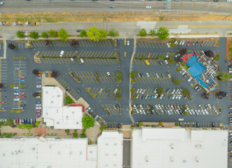 A parking lot with a building in the background