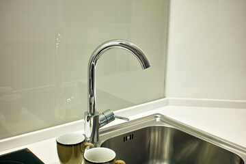 tap and pair of clean mugs