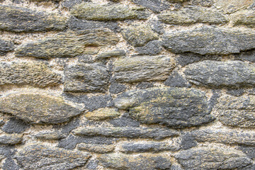 A timeless Breton wall built with old Breton rubble stones showcases rustic charm and heritage. The handcrafted stonework reflects traditional craftsmanship, adding character to any countryside or his