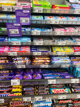 Kyiv, Ukraine - November 24, 2024: Colorful candy and gum display in a retail store shelf