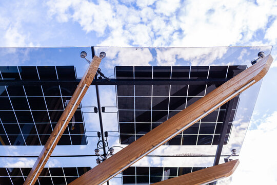Solar panels above electric vehicle charging station