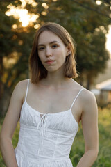 Fototapeta premium A Stunning Portrait of a Young Woman Captured Beautifully in a Natural Outdoor Setting