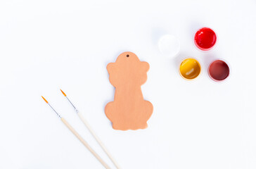 Drawing a monkeyon on a clay figurine. Creativity for children.