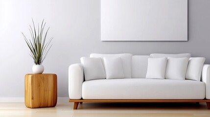 Naklejka premium White couch sits in a room with a white wall and a wooden coffee table. The couch is surrounded by white pillows and a potted plant. The room has a clean and minimalist look, with the white couch