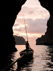 A woman in mainsails and caves, sunset