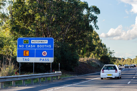 M7 motorway with e tag sign and p plater car driving past on road