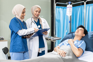 Obraz premium Female Doctor and Assistant Examining Male Patient's Health.