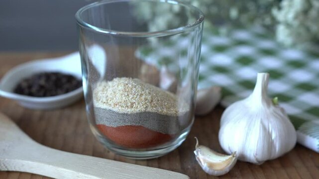 Dried garlic close-up. Spice mix in a clear glass.