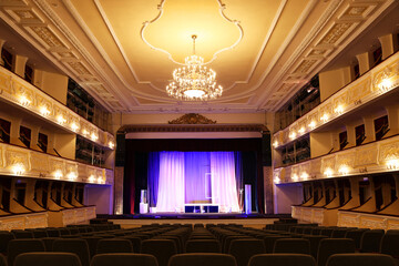 Theatre interior with stage and rows of comfortable seats