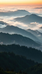 Misty mountain range at sunrise with peaks shrouded in fog, outdoors, sunrise