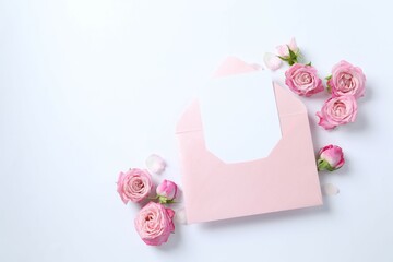 Beautiful composition with pink roses on white background 