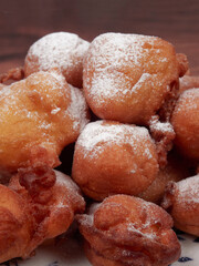 Traditional doughnuts poured with the spoon