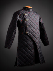 Historical fashion. Medieval knight cloth. Padded jacket gambeson.