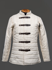 Historical fashion. Medieval knight cloth. Padded jacket gambeson.