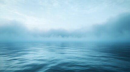 Obraz premium Serene Foggy Waterscape Over Calm Blue Sea