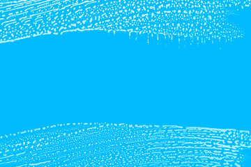 soap foam wipe marks on window glass, blue background