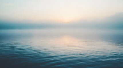 Fototapeta premium Serene Sunrise Over Foggy Calm Water