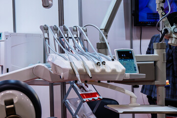 Height adjustable dental unit handpiece holders.